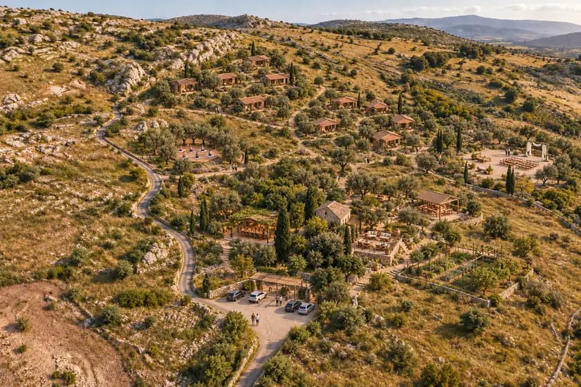 Concept visual of Zabut's timber guest houses across the hillside